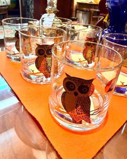A set of mid-century rocks glasses decorated with owls